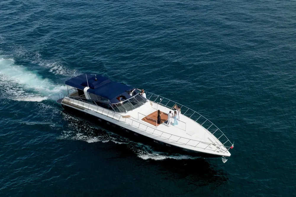 Aerial of Bote cruising with wake on deep blue water