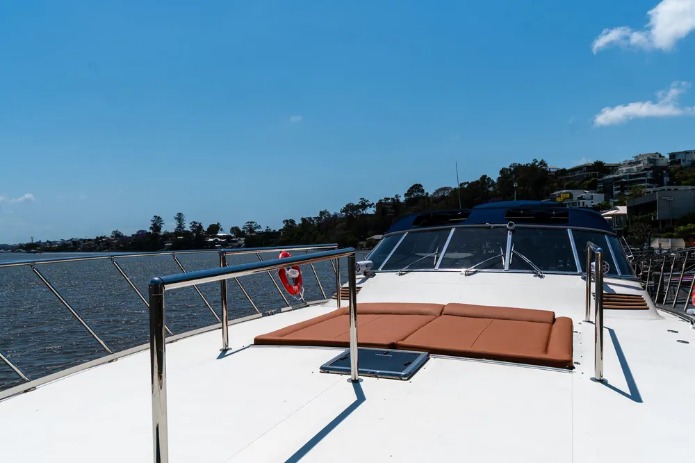 Bow of Bote with tan sunpads and stainless rails