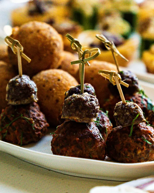 Italian meatballs and arancini canapes on skewers