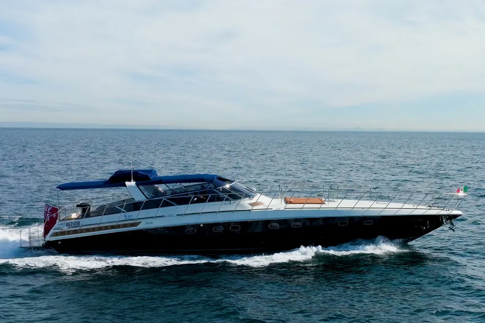 Bote running at speed, side profile with navy hull and white superstructure